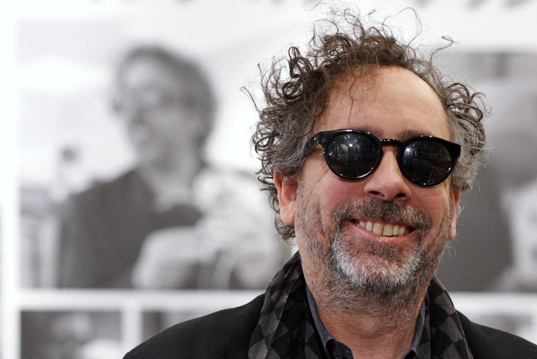 Director Tim Burton smiles at the opening ceremony for "Frankenweenie Art Exhibition" at a store in Tokyo December 4, 2012. The exhibition, which showcases the film's animation process, characters and sketches, will be held at the "Biqlo" store until December 23. REUTERS/Yuriko Nakao (JAPAN - Tags: ENTERTAINMENT)