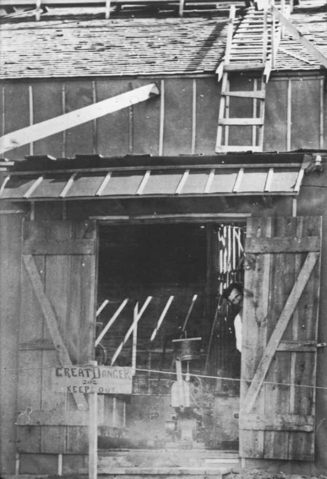 Tesla peeking out of his laboratory in Colorado Springs (1899).
